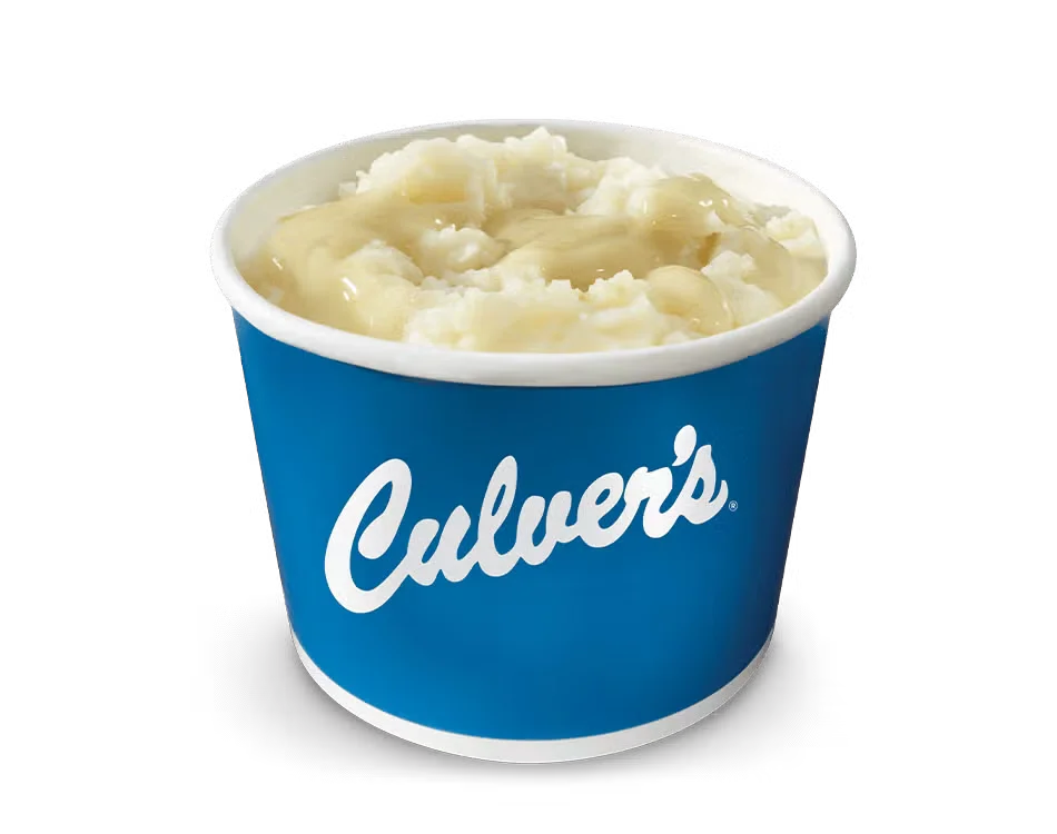 Culver’s Mashed Potatoes & Gravy served warm with smooth potatoes and rich brown gravy in a classic comfort food side