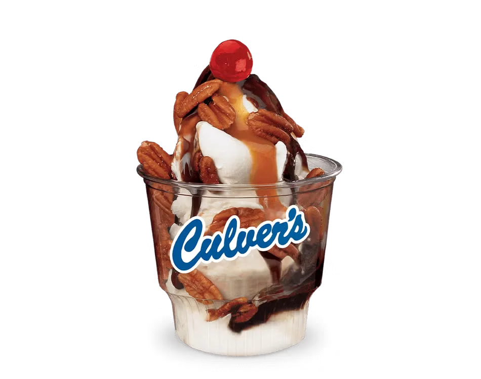 Culver’s Turtle Sundae with vanilla frozen custard, hot fudge, caramel, and roasted pecan halves in a cup